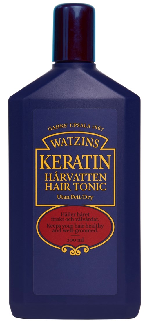 Blue bottle of keratin hair tonic with gold and red label, produced in Sweden. For dry hair.