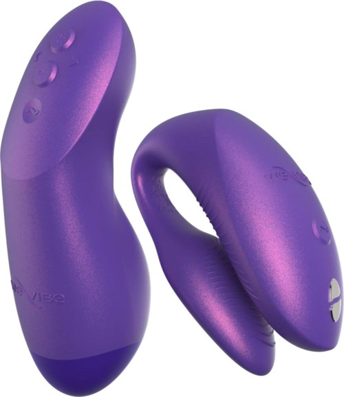 Lila personlig massager med två motorer, knappar och ergonomisk design.