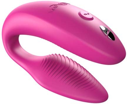 Ein pinkes, gebogenes Gerät mit Tasten und textured Griff, wahrscheinlich ein Massagegerät oder elektronisches Gerät.