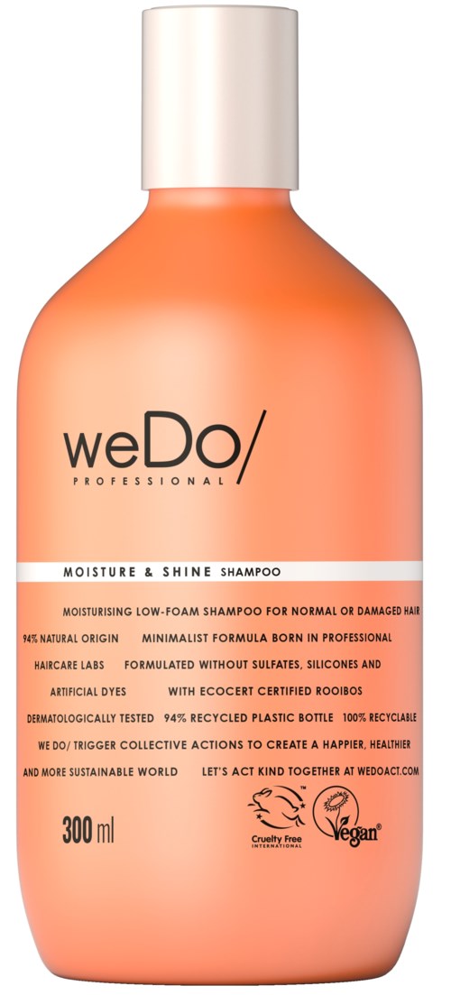 Persikanvärinen pullo, jossa on valkoinen korkki, sisältää weDo/ Professional Moisture & Shine Shampoo.