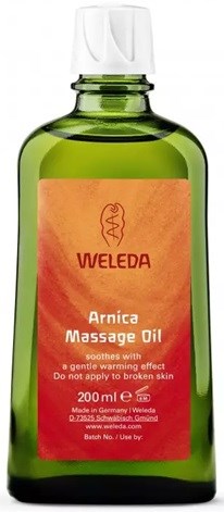 Groene fles met oranje label, zegt Weleda Arnica Massage Oil voor spierverlichting, 200 ml, Duitsland.