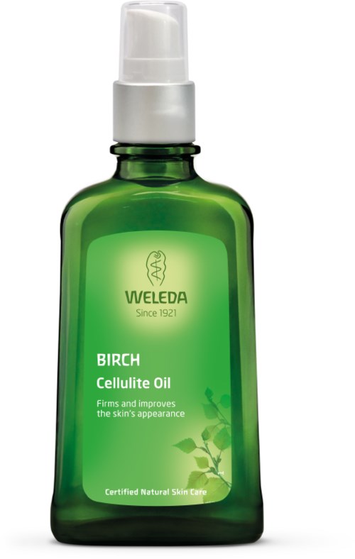 Grüne Flasche mit Weleda Birken Cellulite Oil, mit weißer Pumpe und natürlichem Blattdesign auf dem Etikett.