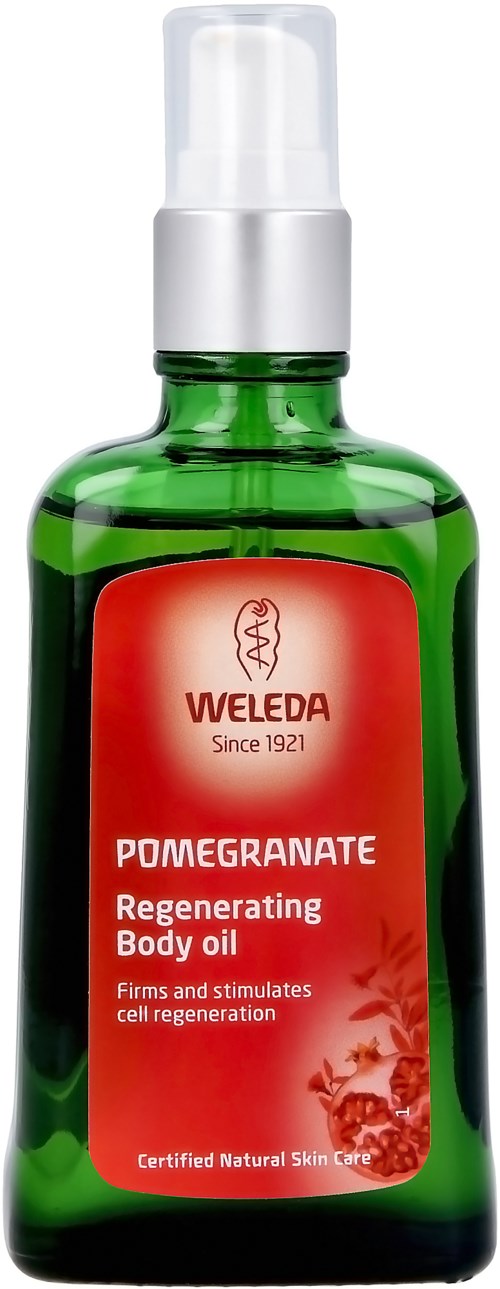Eine grüne Flasche mit weißem Pumpspender, gekennzeichnet 'Weleda Pomegranate Regenerating Body Oil' für Hautpflege.