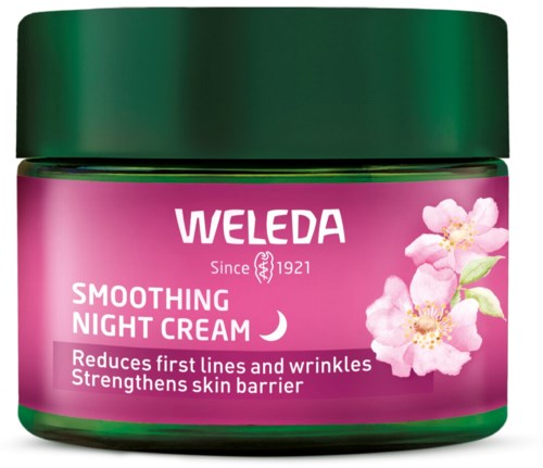 Roze pot met groene deksel, met bloemen, Weleda-merk en productnaam Smoothing Night Cream.