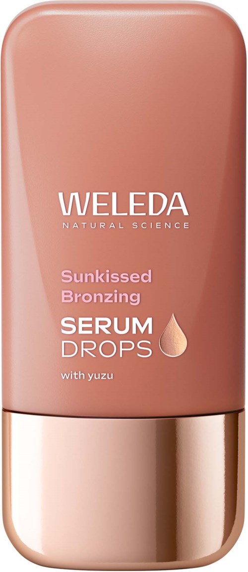 Roze fles met Weleda serumdruppels met yuzu, bedoeld voor zonnen of zelfbruinering zonder zon.
