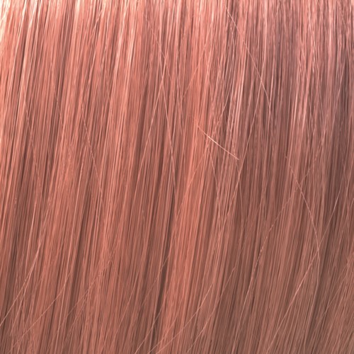 Close-up of copper-colored hair strands, shiny and smooth, flowing down naturally.