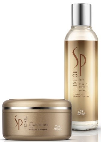 Zwei Haarpflegeprodukte in goldfarbenen Behältern, eine Dose und eine Flasche, mit elegantem Design und silbernen Verschlüssen.