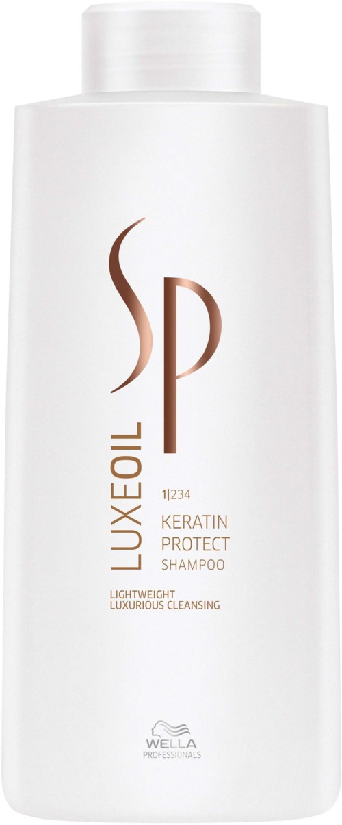 Witte shampoo fles met bruine en grijze tekst, label "LUXE OIL" en "KERATIN PROTECT".