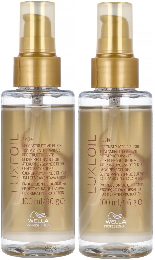 Twee flessen Wella Luxe Oil haarverzorging met gouden doppen en doorzichtige flessen.