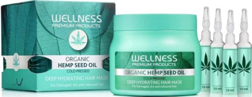 Wellness hennephaarmasker en olie in groene dozen en kleine flesjes voor beschadigd, droog haar.