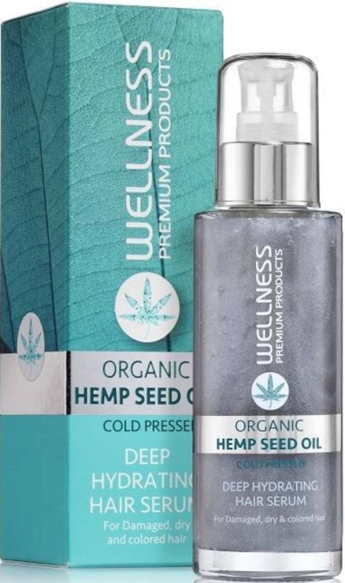 Een flesje organic hennepzaadolie haarserum met een blauwe doos op de achtergrond. Het serum helpt bij droog, beschadigd of gekleurd haar.