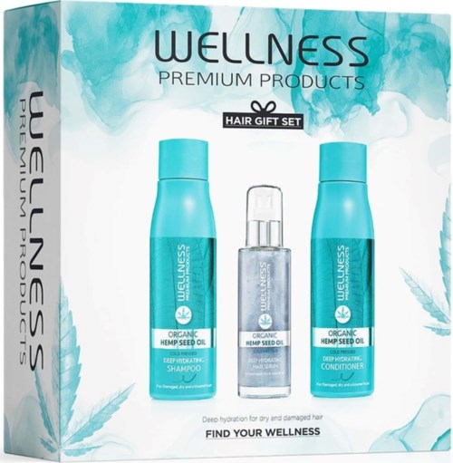Wellness hair gift set with shampoo, conditioner, and serum, all in blue bottles featuring hemp seed oil.