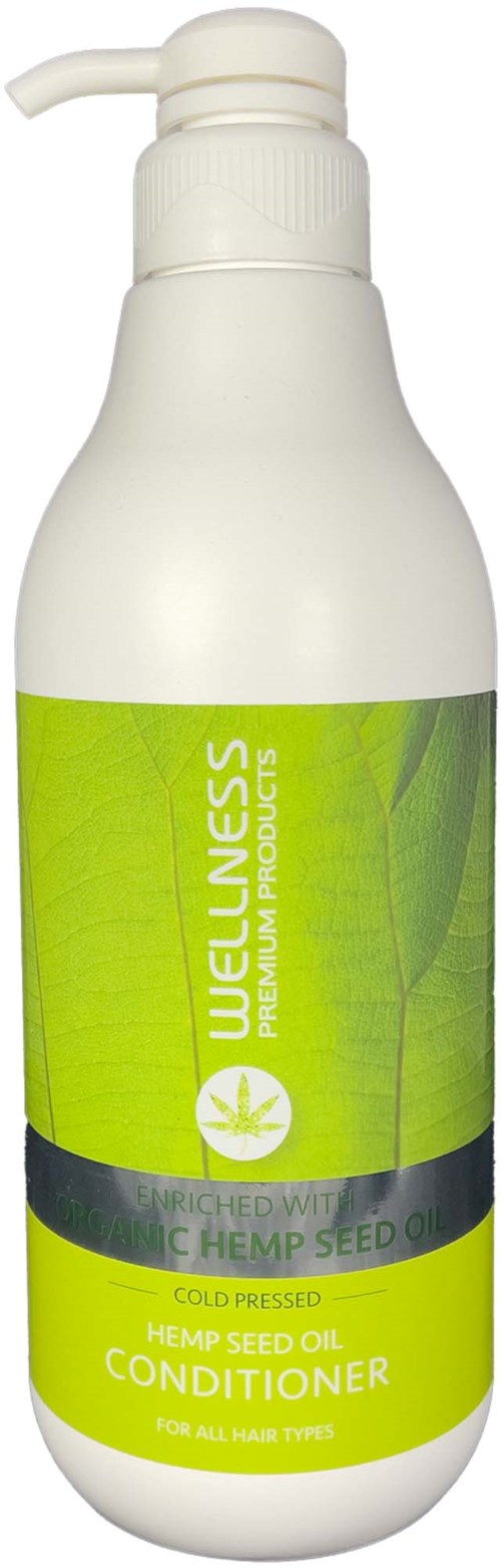 Een witte fles met pomp, labelt 'Wellness Premium Products' en 'Hennepzaadolie Conditioner' in groen en geel.