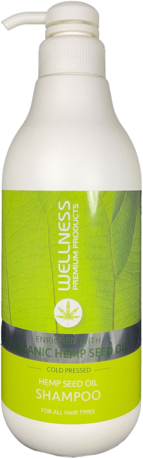 A white bottle labeled Wellness Hemp Seed Oil Shampoo with a green label and pump dispenser.