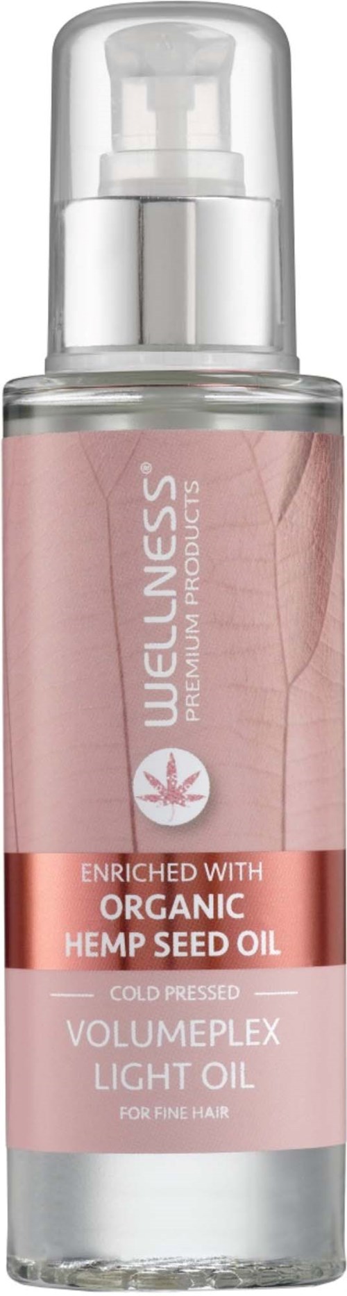 Een klein roze flesje met pomp, gelabeld als wellness haarolie met hennepzaadolie, voor fijn haar.