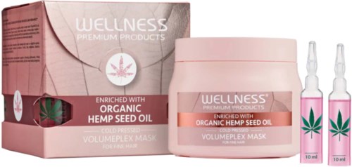Een roze haarmaskerpotje en twee kleine ampullen met hennepzaadolie, allemaal van Wellness premium producten.