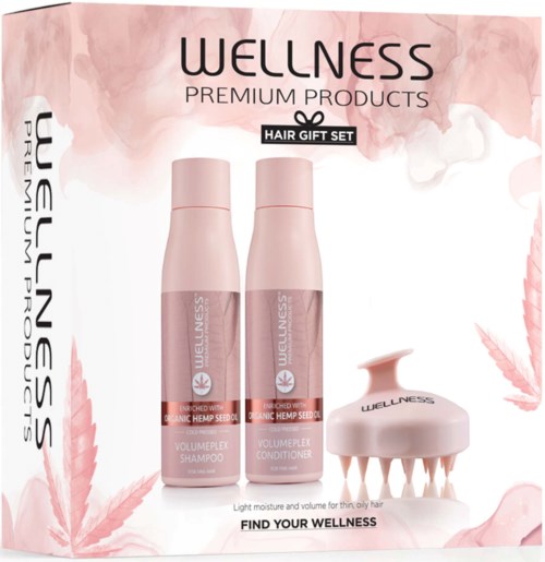 Wellness hair care set with shampoo, conditioner, and scalp massage tool in pink bottles.