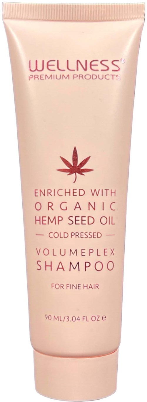 Pink tube of shampoo labeled as enriched with organic hemp seed oil, for fine hair, by Wellness.