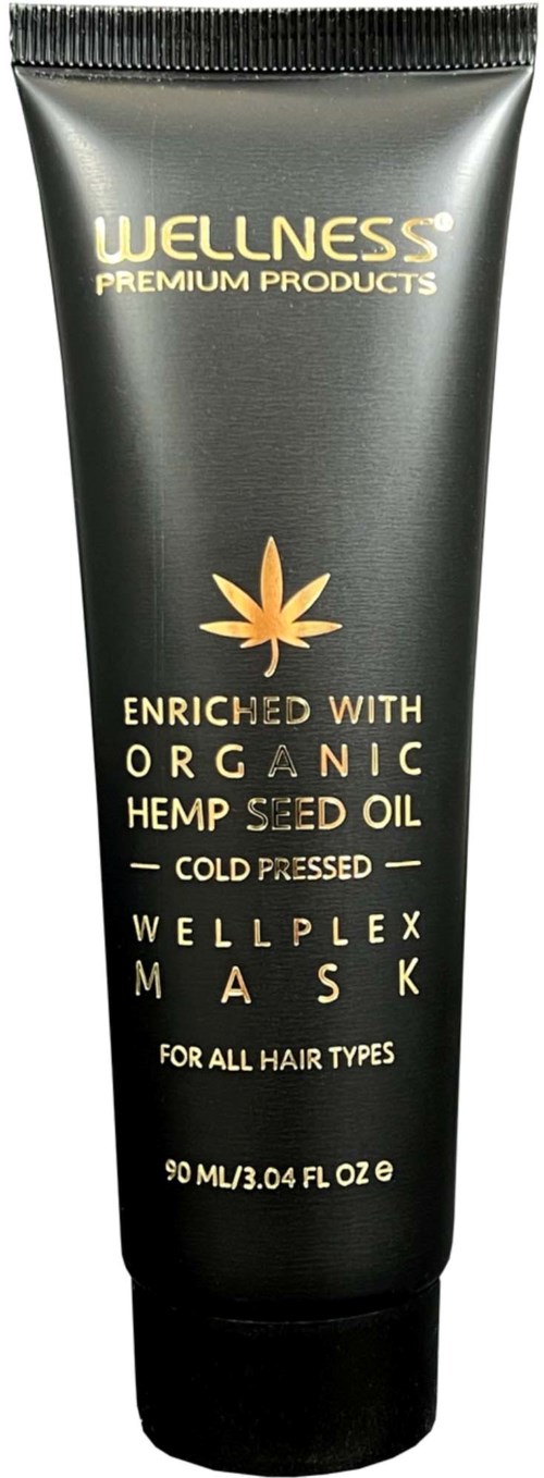 Een zwarte tube wellness haarmasker met een hennepblad, gelabeld als biologische hennepzaadolie, voor alle haartypes.