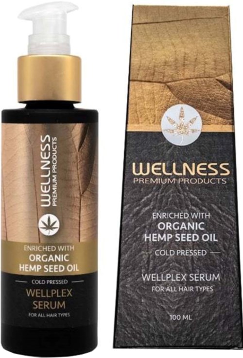 Een serumfles met gouden pomp en doos, beide gelabeld 'Wellness' met informatie over hennepzaadolie.