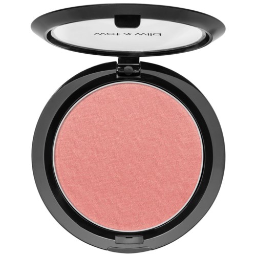 A round blush makeup compact with pink powder inside and a clear lid that has writing on it.