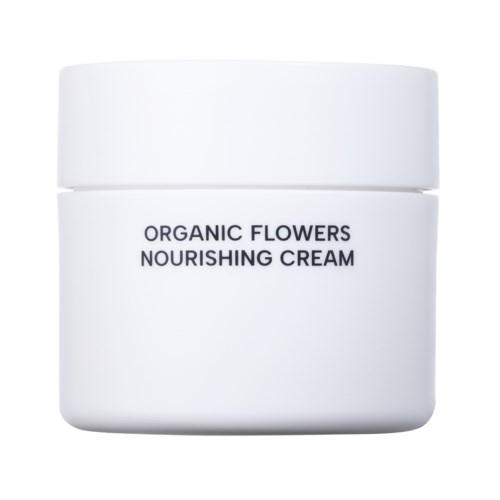 Ein weißer Behälter mit der Aufschrift 'Organic Flowers Nourishing Cream' in einfachem, sauberem Design.