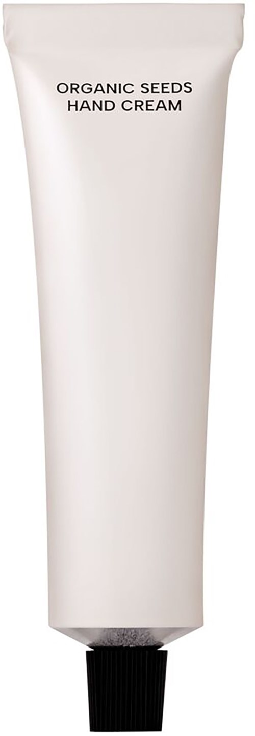 Weiße Tube mit der Aufschrift 'Organic Seeds Hand Cream' und schwarzem Deckel.