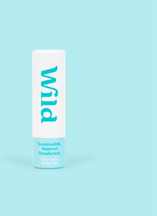 A white and blue cylindrical deodorant stick with "Wild" written vertically, on a light blue background.