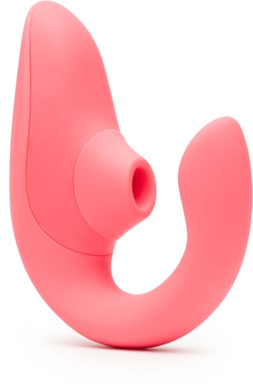 A pink, curved device with a rounded tip and a small hole, designed for personal use.