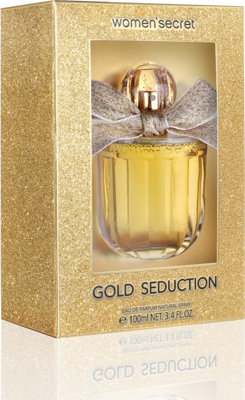 Ein Parfümflasche in einem gold glitzernden Karton mit Schleife, beschriftet 'Gold Seduction' von Women's Secret.