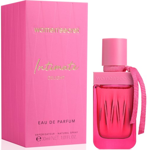 Rosa parfymflaske og eske med teksten 'women'secret Intimate Delight', dekorativ rosa snor på flasken.