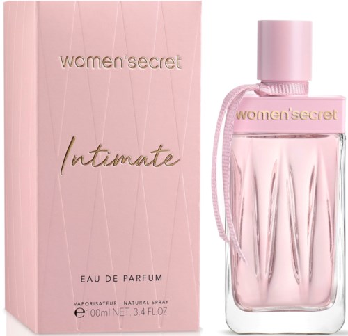 Een roze parfumfles met bijpassende doos, gemarkeerd 'women'secret intimate' en 'Eau de Parfum' in goudletters.