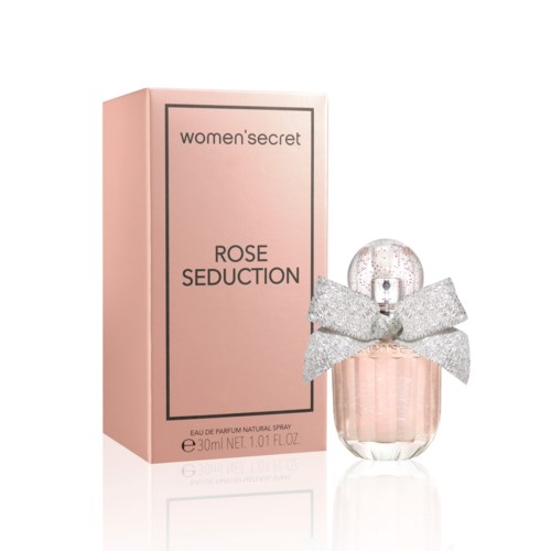 Valkoinen parfymipakkaus, jossa lukee 'women'secret ROSE SEDUCTION', ja siihen kuuluva pullo koristeltu hopeanvärisellä glitter-rusetilla.