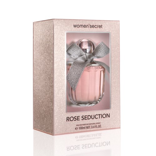 A perfume bottle with a pink liquid, silver bow on top, inside a pink box labeled 'Rose Seduction', women's secret.