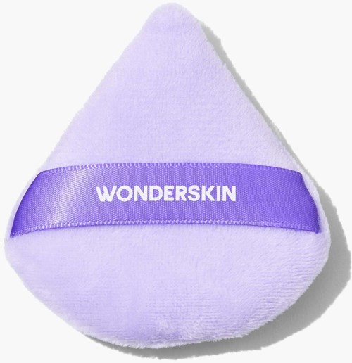 A purple sponge with a ribbon labeled 'WONDERSKIN' around it.