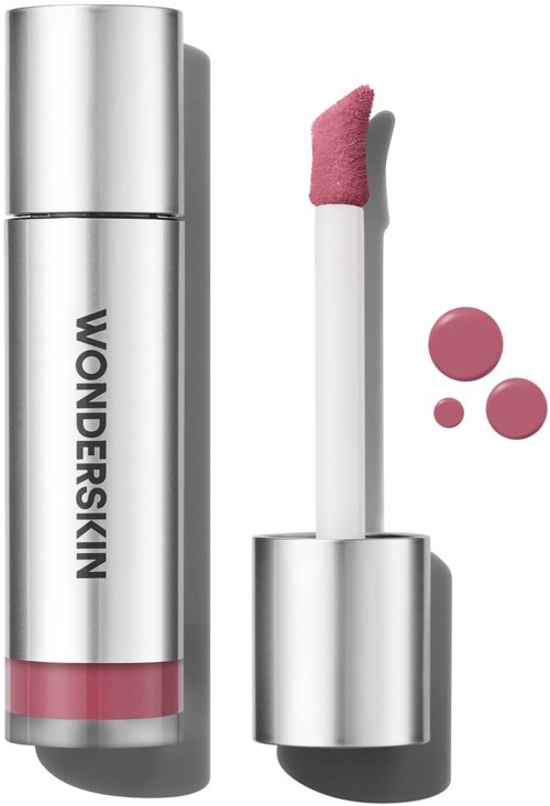 Lip gloss in a silver tube with pink shade and applicator. Three pink dots next to the tube.