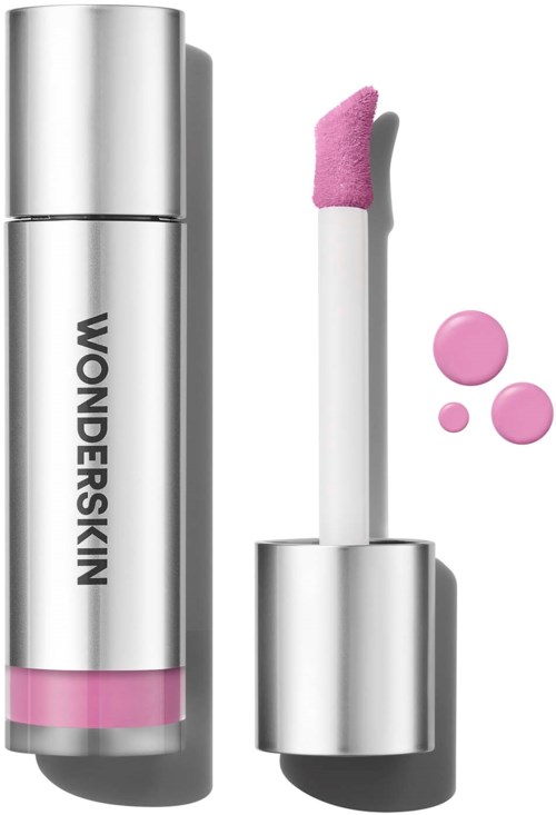 Lip gloss tube with a pink-tinted applicator and droplets of gloss. Silver packaging with "WONDERSKIN" written on it.