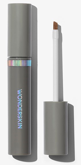 A gray lip gloss tube with a clear section showing a shiny, iridescent layer, and the brand name "WUNDERSKIN".