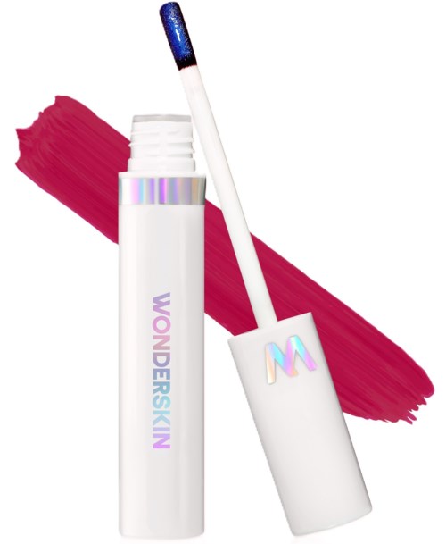 A white lip gloss tube with a rainbow-colored logo and a long applicator wand, placed over a red brushstroke background.