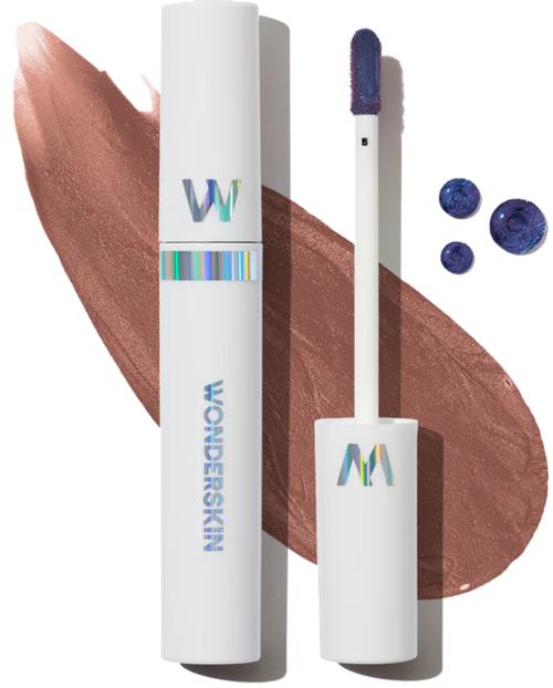 A lipstick in a white case with colorful logo, purple lip gloss, and blue bubbles on a brown lipstick swipe.