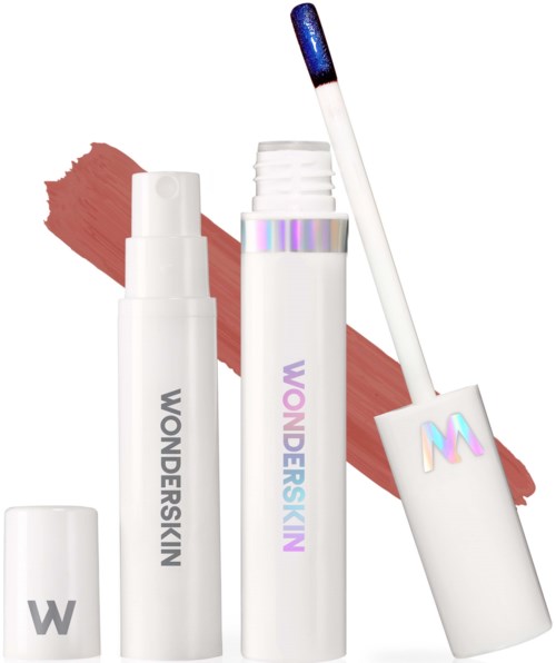 A lip gloss tube with a blue tint, a white bottle with a pump, and a lipstick with a cap. Background is a swatch of pinkish-brown.