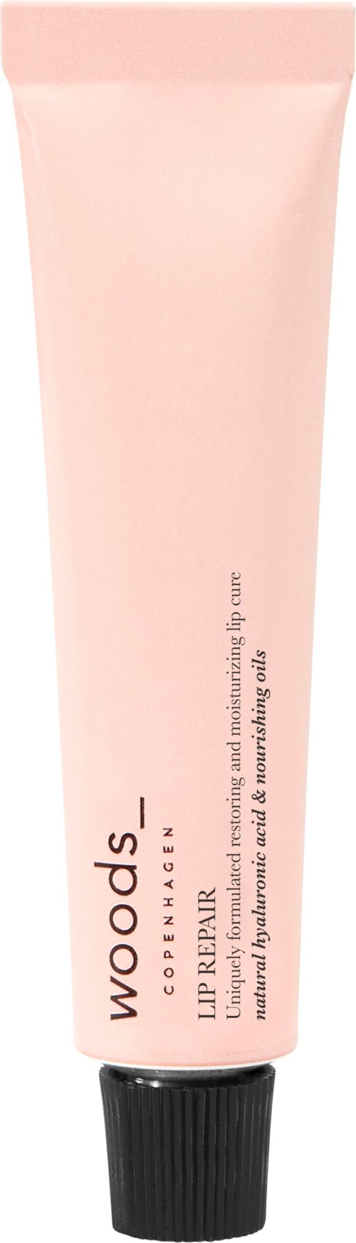 Ein blassrosa Tube von Woods Lippenprimern mit schwarzem Deckel, gekennzeichnet als Make-up-Produkt für Lippen.