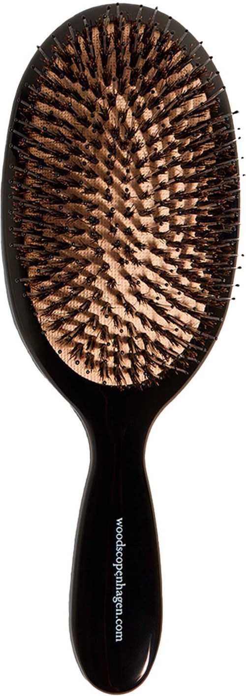 A black hairbrush with brown bristles. The handle has a website URL printed on it. The brush is oval-shaped.