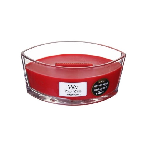Eine rote Kerze in einem Glas mit WoodWick-Label, duftet nach Preiselbeeren.