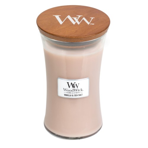 WoodWick-sytyt, jossa on puisilukko, merkinnällä Vanilja & Merisuola, kirkkaassa lasipurkissa.