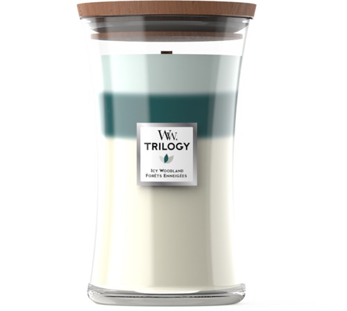 Et glasslys med brun lokk, lagd med blå og kremfarget voks, og en etikett med teksten "W.W. TRILOGY".