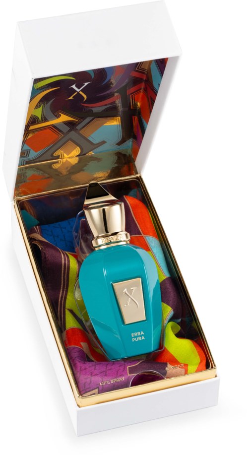 Een blauw parfumflesje met een gouden dop in kleurrijk inpakpapier in een decoratieve doos.
