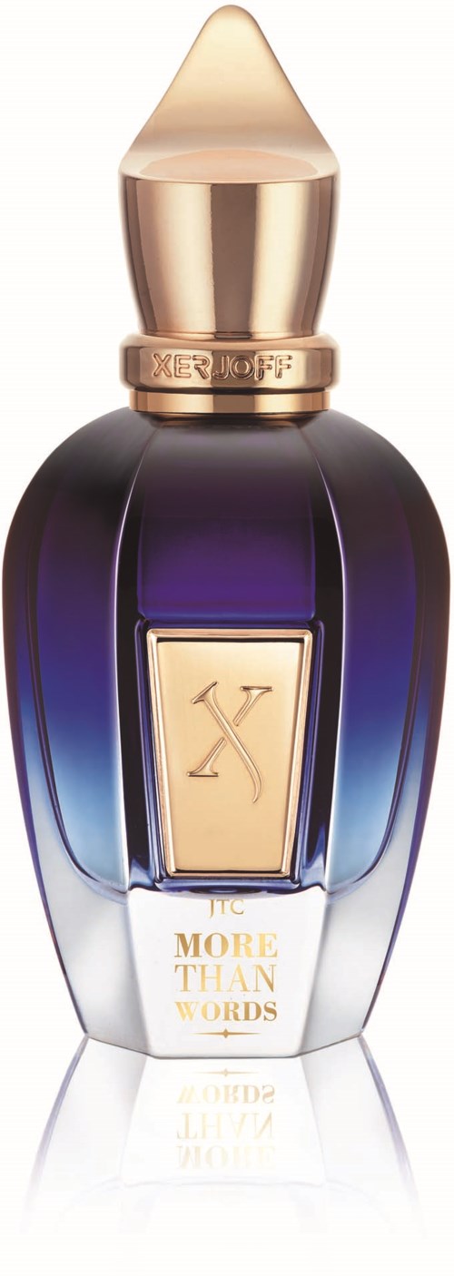 Een parfumbot met goud- en paarse ontwerp, een gouden dop en een label dat zegt "More Than Words."