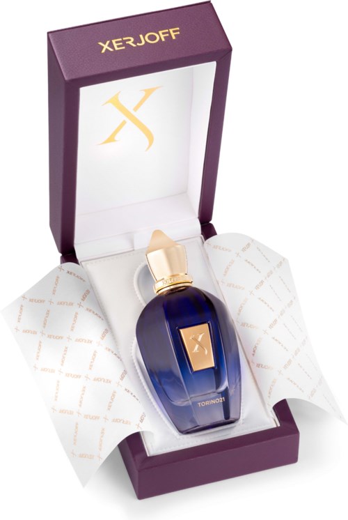 A perfume bottle in a purple box with the brand name XERJOFF and gold details.