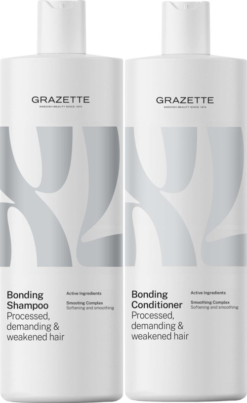 Twee witte flessen haarverzorgingsproducten: shampoo en conditioner, met grijze en zwarte tekst en ontwerp op de labels.